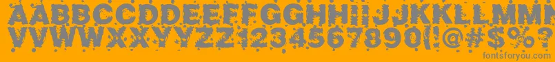 Marusya-fontti – harmaat kirjasimet oranssilla taustalla