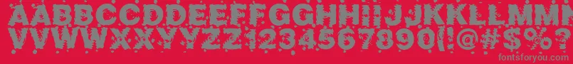 Marusya-fontti – harmaat kirjasimet punaisella taustalla