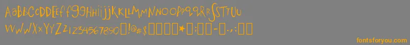 フォントBigfish – オレンジの文字は灰色の背景にあります。