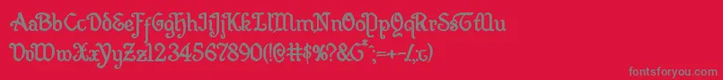 フォントQuillswordbold – 赤い背景に灰色の文字