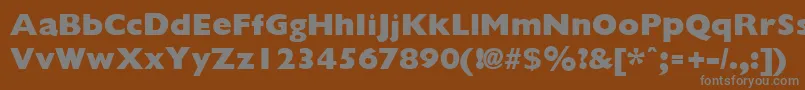 GiliganextraboldRegular-fontti – harmaat kirjasimet ruskealla taustalla