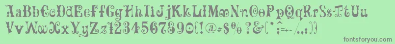 フォントGeFrills – 緑の背景に灰色の文字