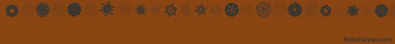 PaperSnowflakes Font – Black Fonts on Brown Background