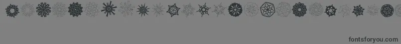 PaperSnowflakes-Schriftart – Schwarze Schriften auf grauem Hintergrund