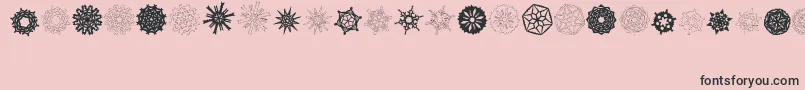 フォントPaperSnowflakes – ピンクの背景に黒い文字