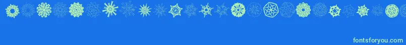 Fonte PaperSnowflakes – fontes verdes em um fundo azul