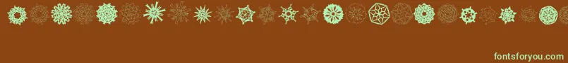 Шрифт PaperSnowflakes – зелёные шрифты на коричневом фоне