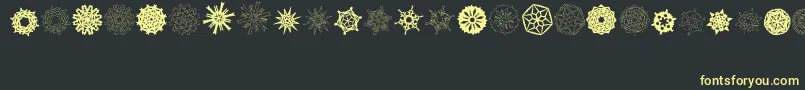 PaperSnowflakes Font – Yellow Fonts on Black Background