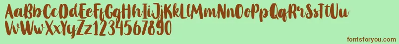 MahoniFreePersonalUse-Schriftart – Braune Schriften auf grünem Hintergrund