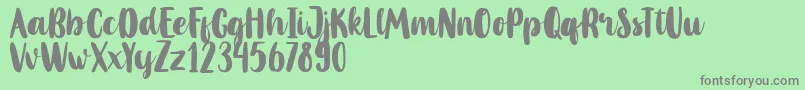 MahoniFreePersonalUse-Schriftart – Graue Schriften auf grünem Hintergrund