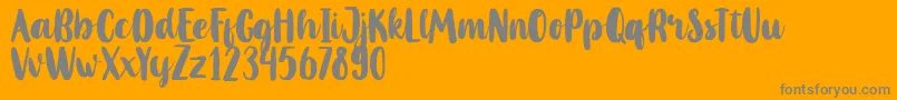 フォントMahoniFreePersonalUse – オレンジの背景に灰色の文字