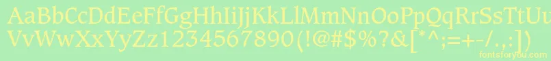 CaxtonstdBook-fontti – keltaiset fontit vihreällä taustalla