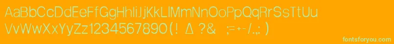 Arctik1-Schriftart – Grüne Schriften auf orangefarbenem Hintergrund
