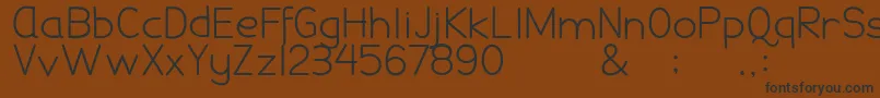 DamaiPelajar-fontti – mustat fontit ruskealla taustalla