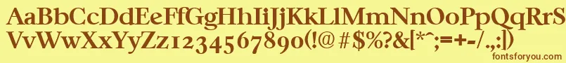 フォントCasablancaSerialBoldDb – 茶色の文字が黄色の背景にあります。