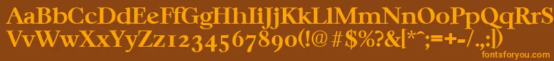 フォントCasablancaSerialBoldDb – オレンジ色の文字が茶色の背景にあります。