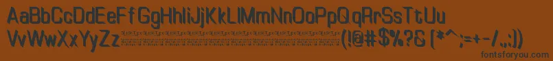 Czcionka TinyplateBoldDemo – czarne czcionki na brązowym tle