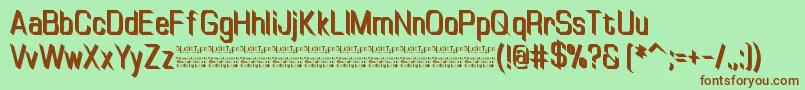 Fonte TinyplateBoldDemo – fontes marrons em um fundo verde