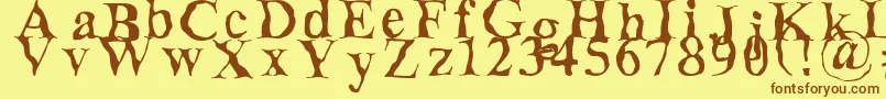 フォントDecomposing – 茶色の文字が黄色の背景にあります。