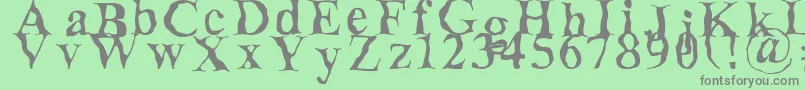 フォントDecomposing – 緑の背景に灰色の文字