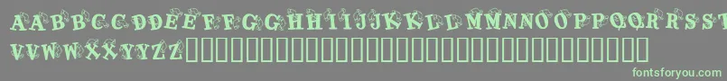 KrKaboomerang-Schriftart – Grüne Schriften auf grauem Hintergrund