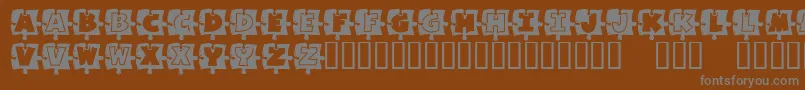 Saiba mais sobre a fonte MissingPiece Fonte MissingPiece – fontes cinzas em um fundo marrom