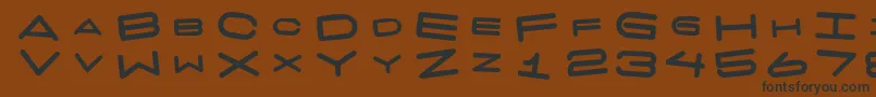 7 Days Fat Rotated Font – Black Fonts on Brown Background