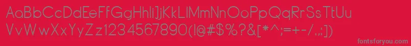 DyelineRegular-Schriftart – Graue Schriften auf rotem Hintergrund