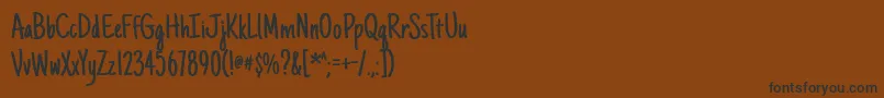 Justanotherhand Font – Black Fonts on Brown Background