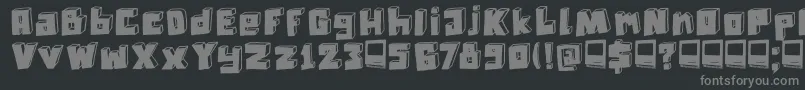 DkTechnojunk-fontti – harmaat kirjasimet mustalla taustalla