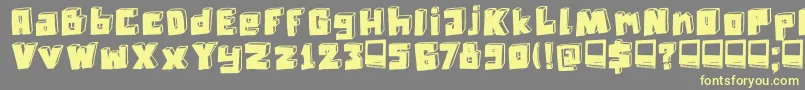DkTechnojunk-fontti – keltaiset fontit harmaalla taustalla