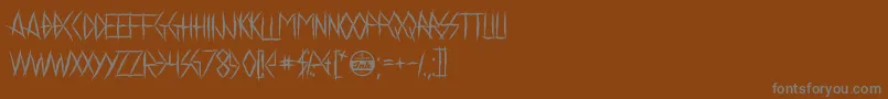 ChelseaSmile-Schriftart – Graue Schriften auf braunem Hintergrund