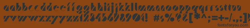 Czcionka Trafaretc – czarne czcionki na brązowym tle
