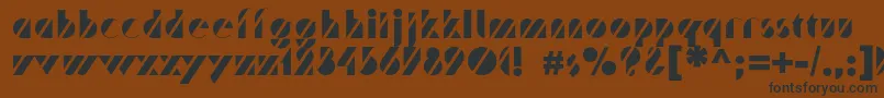 フォントTrafaretc – 黒い文字が茶色の背景にあります