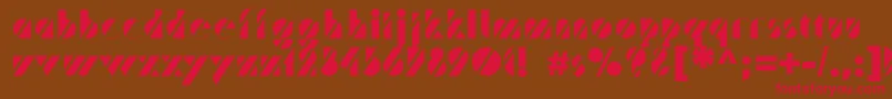 フォントTrafaretc – 赤い文字が茶色の背景にあります。