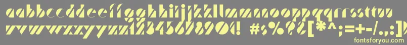 フォントTrafaretc – 黄色のフォント、灰色の背景