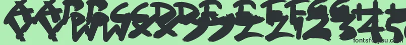 Czcionka SloppyPaint – czarne czcionki na zielonym tle