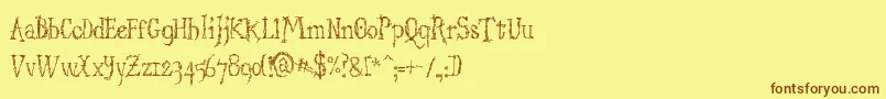 フォントStructdestructSerif32 – 茶色の文字が黄色の背景にあります。