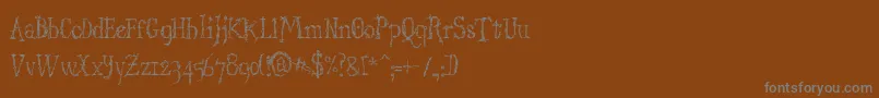 Шрифт StructdestructSerif32 – серые шрифты на коричневом фоне