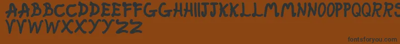 FatFairy Font – Black Fonts on Brown Background
