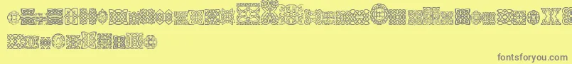 SlCelticStyle-Schriftart – Graue Schriften auf gelbem Hintergrund