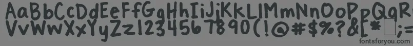 フォントTreatYoSelf – 黒い文字の灰色の背景