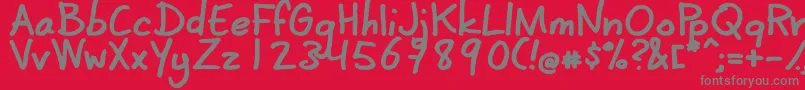 フォントCoertschriftDik – 赤い背景に灰色の文字