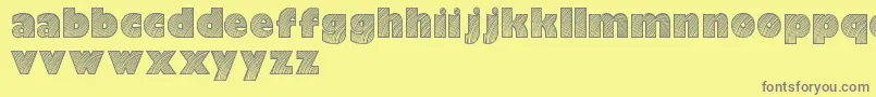 Moarendemo-fontti – harmaat kirjasimet keltaisella taustalla