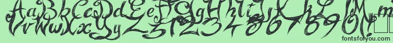 FairyStrange Font – Black Fonts on Green Background