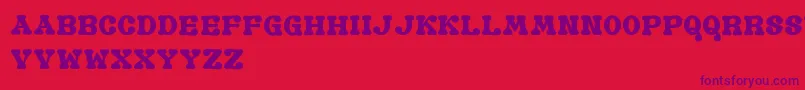 Czcionka GomariceOldBook – fioletowe czcionki na czerwonym tle