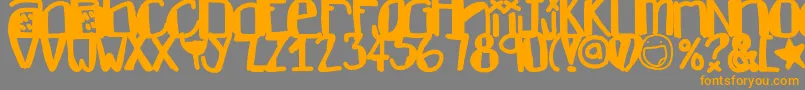 フォントDontlike – オレンジの文字は灰色の背景にあります。
