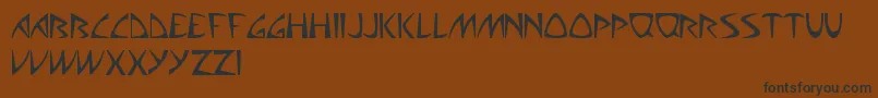 AliensCanSuckIt-Schriftart – Schwarze Schriften auf braunem Hintergrund