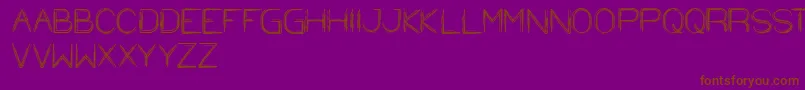 フォントStrawHat – 紫色の背景に茶色のフォント