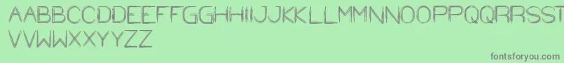 StrawHat-fontti – harmaat kirjasimet vihreällä taustalla